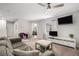Spacious living room with large window and modern entertainment center at 5914 Falconwood Pl, Lithia, FL 33547