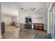 Open-concept living area with hardwood floors, neutral walls, and a ceiling fan at 5914 Falconwood Pl, Lithia, FL 33547