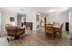 Open floor plan with wood floors, neutral walls, and view of the dining area at 5914 Falconwood Pl, Lithia, FL 33547