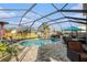 A refreshing screened-in pool with a basketball hoop and a patio area for entertaining at 5914 Falconwood Pl, Lithia, FL 33547