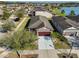 Aerial view of home with attached garage, manicured lawn, and mature trees at 6004 Sweet Birch Dr, Riverview, FL 33578