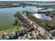Aerial view of lakeside neighborhood featuring water views and proximity to local businesses at 6004 Sweet Birch Dr, Riverview, FL 33578