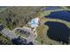 Aerial view of community pool with ample parking and nearby lake access at 6004 Sweet Birch Dr, Riverview, FL 33578