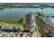 Aerial view of lakeside homes featuring well-maintained lawns and community access at 6004 Sweet Birch Dr, Riverview, FL 33578