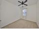 Bedroom featuring neutral carpet with a ceiling fan and large window at 6004 Sweet Birch Dr, Riverview, FL 33578