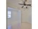 Bedroom featuring tile flooring, neutral paint, and a window view of the outdoors at 6004 Sweet Birch Dr, Riverview, FL 33578