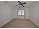 Bedroom with neutral carpeting, a large window and ceiling fan at 6004 Sweet Birch Dr, Riverview, FL 33578