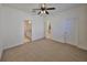 Spacious bedroom with neutral carpet and easy access to the bathroom and kitchen at 6004 Sweet Birch Dr, Riverview, FL 33578