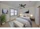 Stylishly decorated bedroom with a ceiling fan, accent rug and bench at 6004 Sweet Birch Dr, Riverview, FL 33578