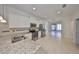 Bright kitchen featuring stainless steel appliances and a breakfast bar at 6004 Sweet Birch Dr, Riverview, FL 33578