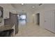 Kitchen features stainless steel appliances, tiled floor and access to the back yard at 6004 Sweet Birch Dr, Riverview, FL 33578