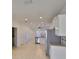 Bright open kitchen and dining area with stainless steel appliances and tile flooring at 6004 Sweet Birch Dr, Riverview, FL 33578