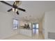 Open-concept kitchen with white cabinets, stainless steel appliances, eat in bar and plenty of natural light at 6004 Sweet Birch Dr, Riverview, FL 33578