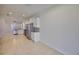 Bright open kitchen and dining area with stainless steel appliances and tile flooring at 6004 Sweet Birch Dr, Riverview, FL 33578