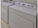 Laundry room featuring a Whirlpool washer and dryer set at 6004 Sweet Birch Dr, Riverview, FL 33578