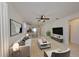 Spacious living room with a ceiling fan and neutral décor, leading to the kitchen and dining area at 6004 Sweet Birch Dr, Riverview, FL 33578