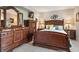 Well-appointed bedroom with coordinating dark wood furniture and bright decor at 6268 Palma Del Mar S Blvd # 101, St Petersburg, FL 33715