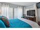 Bedroom with a wooden bed frame and view of a flat screen television at 6268 Palma Del Mar S Blvd # 101, St Petersburg, FL 33715