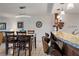 Open concept: Dining area with seating for four, next to the bar and kitchen at 6268 Palma Del Mar S Blvd # 101, St Petersburg, FL 33715