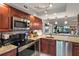Updated kitchen showcasing stainless steel appliances and granite countertops at 6268 Palma Del Mar S Blvd # 101, St Petersburg, FL 33715