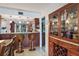 Open kitchen design with dark wood cabinetry, granite countertops, and a bar counter with seating at 6268 Palma Del Mar S Blvd # 101, St Petersburg, FL 33715