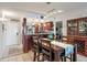 View of the kitchen through the dining area with bar seating and dark wood cabinets at 6268 Palma Del Mar S Blvd # 101, St Petersburg, FL 33715