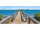 Wooden community dock overlooking beautiful water views and landscaping at 6268 Palma Del Mar S Blvd # 101, St Petersburg, FL 33715