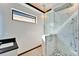 Stylish bathroom featuring a walk-in shower with black pebble floor and modern fixtures at 6536 Simone Shores Cir, Apollo Beach, FL 33572