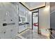 Elegant bathroom with a glass shower, marble accents, and a bidet-style toilet at 6536 Simone Shores Cir, Apollo Beach, FL 33572