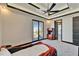Car bed in a modern bedroom with a dark ceiling fan and a sliding door to the outside at 6536 Simone Shores Cir, Apollo Beach, FL 33572