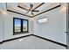 Bright bedroom features modern ceiling fan, recessed lighting, and large windows with an airy feel at 6536 Simone Shores Cir, Apollo Beach, FL 33572