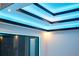 Bedroom with cove lighting, wall of windows, and access to the exterior at 6536 Simone Shores Cir, Apollo Beach, FL 33572