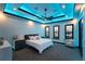 Well lit bedroom with tray ceilings and modern lighting at 6536 Simone Shores Cir, Apollo Beach, FL 33572