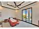 Bright bedroom with car bed, modern ceiling fan and sliding glass doors to outdoor patio at 6536 Simone Shores Cir, Apollo Beach, FL 33572
