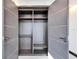 Walk-in closet with built-in shelving and organizational system for optimal storage at 6536 Simone Shores Cir, Apollo Beach, FL 33572