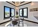 Cozy dining nook with modern light fixture and views of the outdoor grill area at 6536 Simone Shores Cir, Apollo Beach, FL 33572