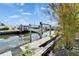 Exterior shot of a boat lift and dock on the canal at 6536 Simone Shores Cir, Apollo Beach, FL 33572