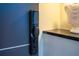 Smart lock system on a modern dark door at 6536 Simone Shores Cir, Apollo Beach, FL 33572