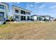 Beautiful two-story home featuring a stucco exterior, fenced in yard and elegant architectural details at 6536 Simone Shores Cir, Apollo Beach, FL 33572