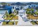 Beautiful home with manicured landscaping, palm trees, and a paver driveway at 6536 Simone Shores Cir, Apollo Beach, FL 33572
