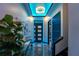 Elegant foyer with modern lighting, stylish console table, and striking artwork at 6536 Simone Shores Cir, Apollo Beach, FL 33572