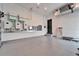 Spacious garage featuring a solar battery system, an electric panel, and epoxy flooring at 6536 Simone Shores Cir, Apollo Beach, FL 33572