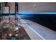 Sleek hallway with marble floors, glass railings, and modern lighting highlighting the elegant interior design at 6536 Simone Shores Cir, Apollo Beach, FL 33572