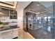 Modern kitchen featuring sleek gray cabinetry, stainless steel appliances, and a stylish backsplash at 6536 Simone Shores Cir, Apollo Beach, FL 33572