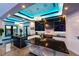 Gourmet kitchen with sleek black cabinetry, quartz countertops, and stainless steel appliances at 6536 Simone Shores Cir, Apollo Beach, FL 33572