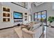 Bright living room with a cozy fireplace, built-in shelving, and comfortable seating, perfect for relaxation at 6536 Simone Shores Cir, Apollo Beach, FL 33572