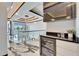 Open-concept design with stylish bar area, recessed lighting, and a captivating chandelier at 6536 Simone Shores Cir, Apollo Beach, FL 33572