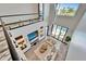 Open-concept living room showcasing high ceilings, modern decor, and seamless access to the pool area at 6536 Simone Shores Cir, Apollo Beach, FL 33572