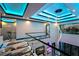 Bright living room with recessed lighting, contemporary chandelier, and sleek glass railings at 6536 Simone Shores Cir, Apollo Beach, FL 33572