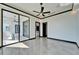 Open-concept room featuring modern fixtures, tile floors, and a seamless indoor-outdoor transition at 6536 Simone Shores Cir, Apollo Beach, FL 33572